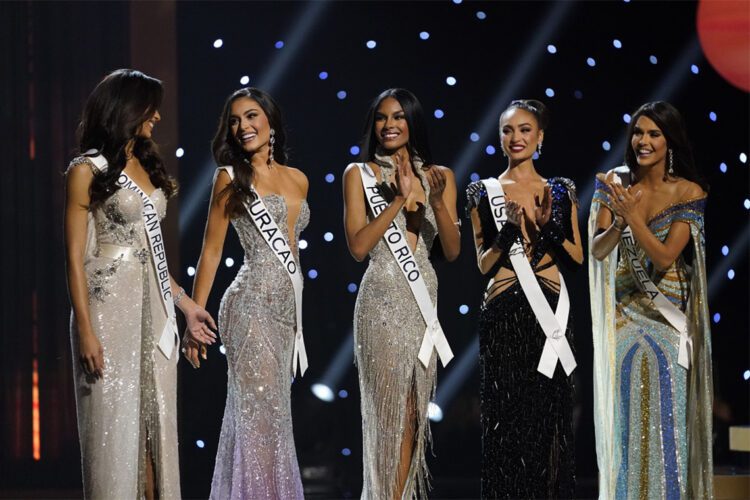 The final five contestants are announced during the final round of the 71st Miss Universe Beauty Pageant in New Orleans, Saturday, Jan. 14, 2023. Left to right are Miss Dominican Republic Andreina Martinez, Miss Curacao Gabriela Dos Santos, Miss Puerto Rico Ashley Carino, Miss USA R'Bonney Gabriel and Miss Venezuela Amanda Dudamel. (AP Photo/Gerald Herbert)