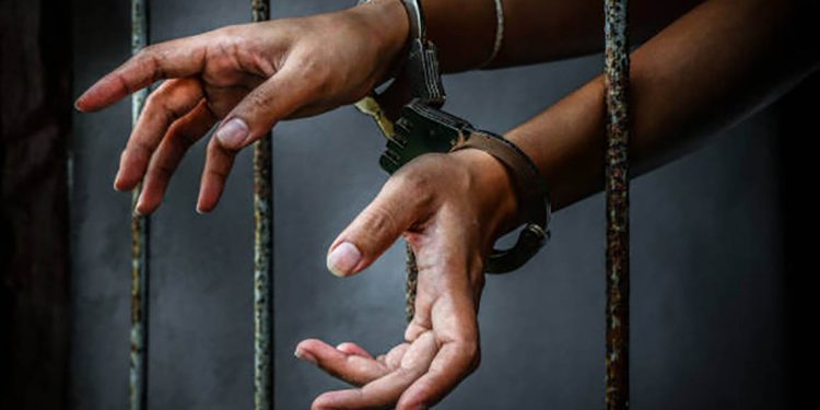 Prisoner in prison with handcuff