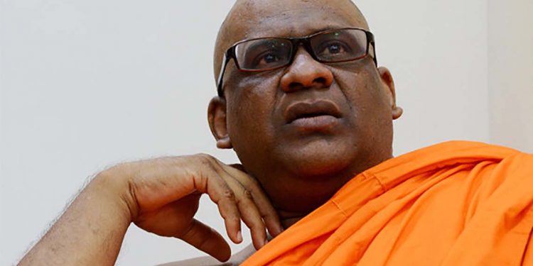 Sri Lankan General Secretary of the Bodu Bala Sena (BBS) Ven. Galagodaatte Gnanasara looks on at the Rukmalgama Temple in Rukmalgama, about 20 kms from Colombo on May 23, 2019.  A firebrand Sri Lankan Buddhist monk serving a six-year jail term for contempt of court was freed on May 23 following a presidential pardon, officials said. Galagodaatte Gnanasara was driven out of the Welikada prison hospital where he had spent much of his sentence since his first imprisonment in June last year.
 / AFP / ISHARA S. KODIKARA
