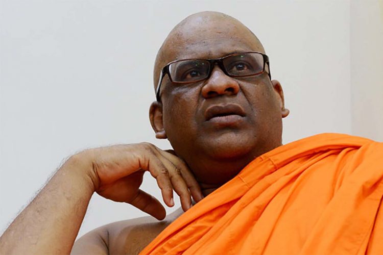 Sri Lankan General Secretary of the Bodu Bala Sena (BBS) Ven. Galagodaatte Gnanasara looks on at the Rukmalgama Temple in Rukmalgama, about 20 kms from Colombo on May 23, 2019.  A firebrand Sri Lankan Buddhist monk serving a six-year jail term for contempt of court was freed on May 23 following a presidential pardon, officials said. Galagodaatte Gnanasara was driven out of the Welikada prison hospital where he had spent much of his sentence since his first imprisonment in June last year.
 / AFP / ISHARA S. KODIKARA