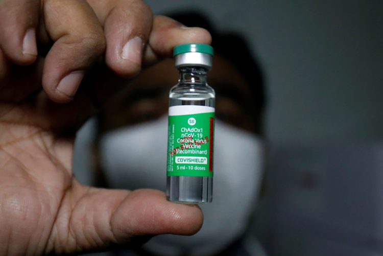 An official displays a vial containing COVISHIELD, a coronavirus disease (COVID-19) vaccine manufactured by Serum Institute of India, after a consignment of the vaccines arrived from the western city of Pune for its distribution, inside a vaccination storage centre in Ahmedabad, India, January 12, 2021. REUTERS/Amit Dave