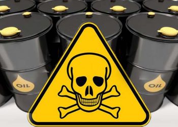 Black metal oil barrels on white background.