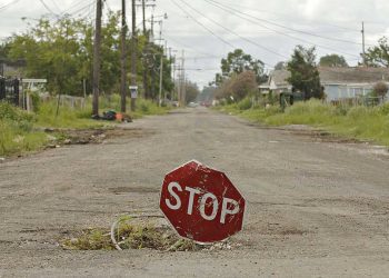 UNITED STATES - AUGUST 06:  A stop sign sits in a hole in a residential street in the Lower Ninth Ward of New Orleans, Louisiana, Sunday, August 6, 2006. U.S. President George W. Bush said last month the U.S. government has committed more than $110 billion to the recovery of the Gulf Coast, declaring "we've got a plan" for the hurricane-battered region, but almost a year after Hurricane Katrina struck, that plan is hard to discern.  (Photo by Daniel Acker/Bloomberg via Getty Images)