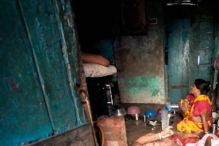 20 June 2010-Kolkata, Bangladesh-A family living in an urban slum in Sonagachi: Half the world’s population (World-6.75 billion as of 2008) lives in cities and towns. One billion people, one out of three urban dwellers are living in slum conditions. (UN Millennium Development Goals Report 2007, UNESCAP 2009) Photo Credit:Kibae Park/Sipa Press