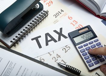 44968867 - office work and filling in tax returns close up