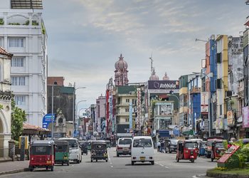 Sri Lanka, Colombo, May 6th 2018. Traditional tuc tuc (the local taxis) and modern cars in the traffic downtown Colombo.