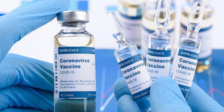 Coronavirus COVID-19 single dose small vials and multi dose in scientist hands concept. Research for new novel corona virus immunization drug.