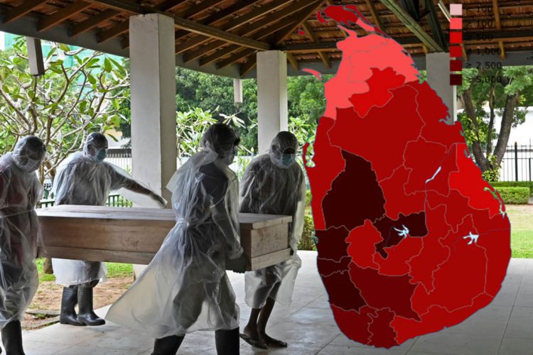 Municipal workers carry the coffin of an unclaimed body of a Covid-19 coronavirus victim to a crematorium in Colombo on December 10, 2020. (Photo by Lakruwan WANNIARACHCHI / AFP)