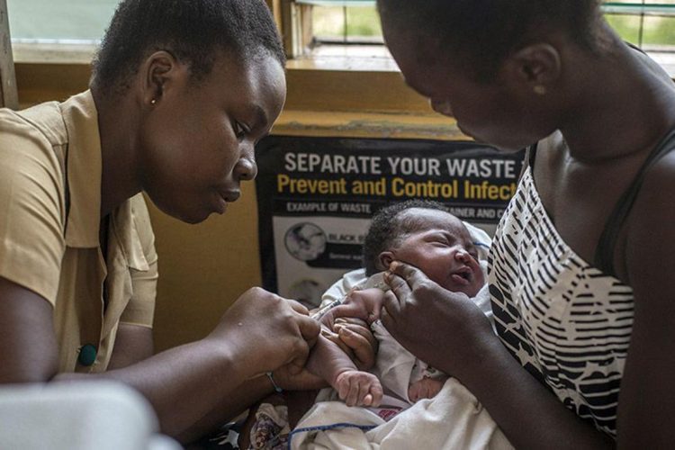 A-nurse-vaccinates-a-baby-against-malaria-in-Ghana -2019