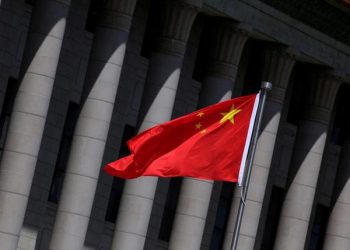 A Chinese flag flutters in front of the Great Hall of the People in Beijing, China, May 27, 2019. REUTERS/Jason Lee