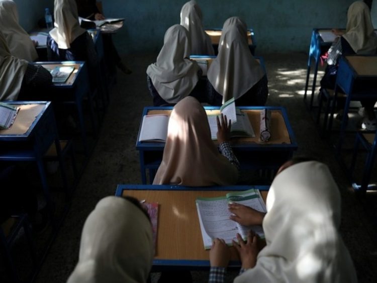 Afghan girls sit in a classroom at a school in Kabul, Afghanistan, September 18, 2021. WANA (West Asia News Agency) via REUTERS ATTENTION EDITORS - THIS PICTURE WAS PROVIDED BY A THIRD PARTY. - RC24SP996PQP