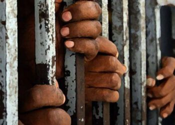 prison-jail-hands-bar