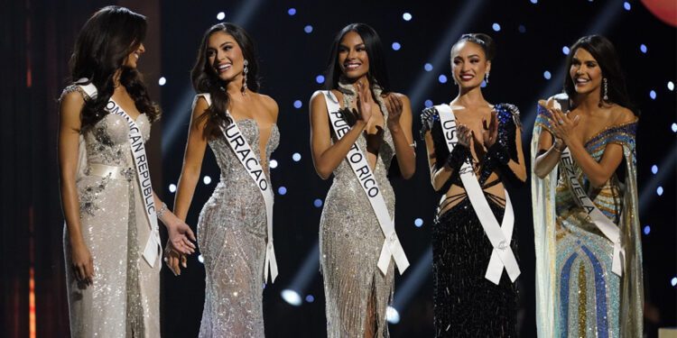 The final five contestants are announced during the final round of the 71st Miss Universe Beauty Pageant in New Orleans, Saturday, Jan. 14, 2023. Left to right are Miss Dominican Republic Andreina Martinez, Miss Curacao Gabriela Dos Santos, Miss Puerto Rico Ashley Carino, Miss USA R'Bonney Gabriel and Miss Venezuela Amanda Dudamel. (AP Photo/Gerald Herbert)