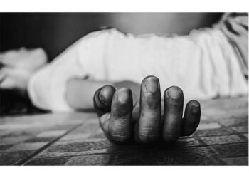 woman unconscious falling on ground on black background in white tone with shadow edge