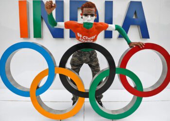 Arun Haryani, 38, a fan, poses with the Olympic rings as he cheers on India's team for the Tokyo 2020 Olympics, in Ahmedabad, India, July 22, 2021. REUTERS/Amit Dave/File Photo