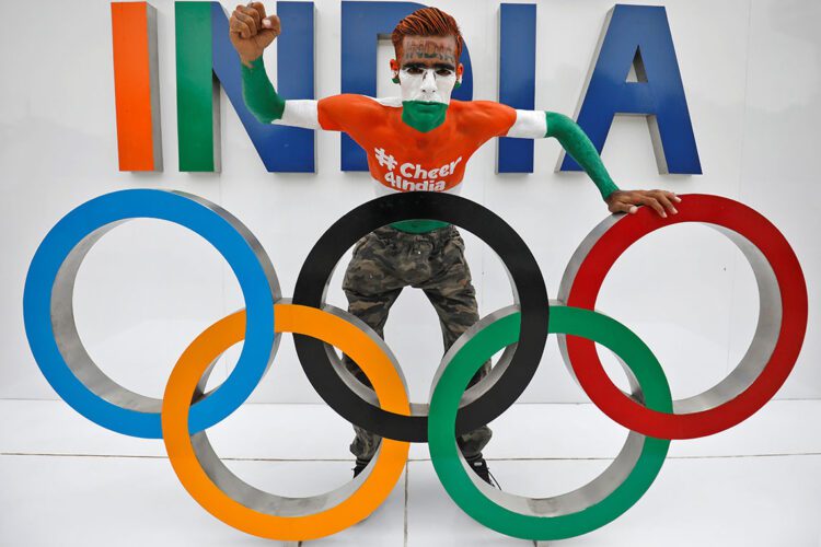 Arun Haryani, 38, a fan, poses with the Olympic rings as he cheers on India's team for the Tokyo 2020 Olympics, in Ahmedabad, India, July 22, 2021. REUTERS/Amit Dave/File Photo