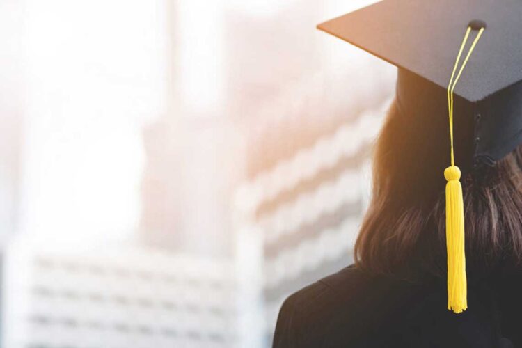 Rear view of a college graduate girl