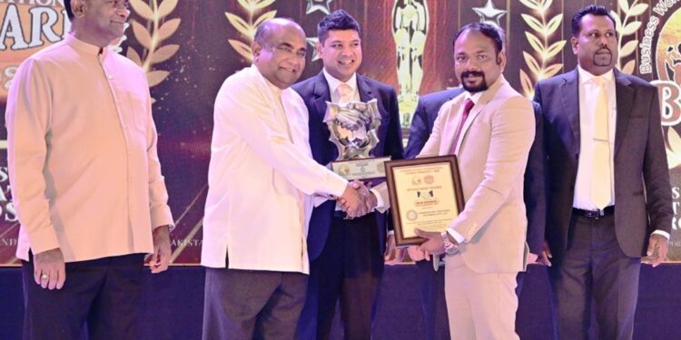 BWIO Main Sponsor Dr. T. Tharesanan - (Chairman - Tharshan Multinational Holdings Pvt Ltd.) receiving the main sponsor award