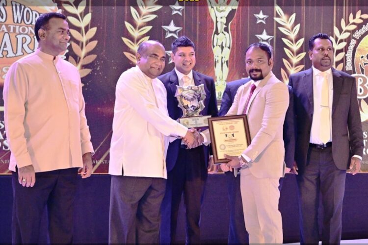 BWIO Main Sponsor Dr. T. Tharesanan - (Chairman - Tharshan Multinational Holdings Pvt Ltd.) receiving the main sponsor award
