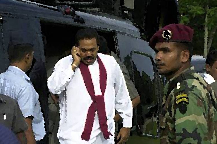 MATARA, SRI LANKA:  Sri Lanka's Prime Minister Mahinda Rajapakse talks on the phone as he exits a helicopter to address a meeting in the southern town of Matara, 14 November 2005, on the final leg of his campaigning for the presidential elections on 17 November 2005.  Sri Lanka deployed troops amid fears of suicide bomb attacks against presidential candidates staging their final campaign rallies ahead of the elections.   AFP PHOTO/Lakruwan Wanniarachchi  (Photo credit should read LAKRUWAN WANNIARACHCHI/AFP via Getty Images)